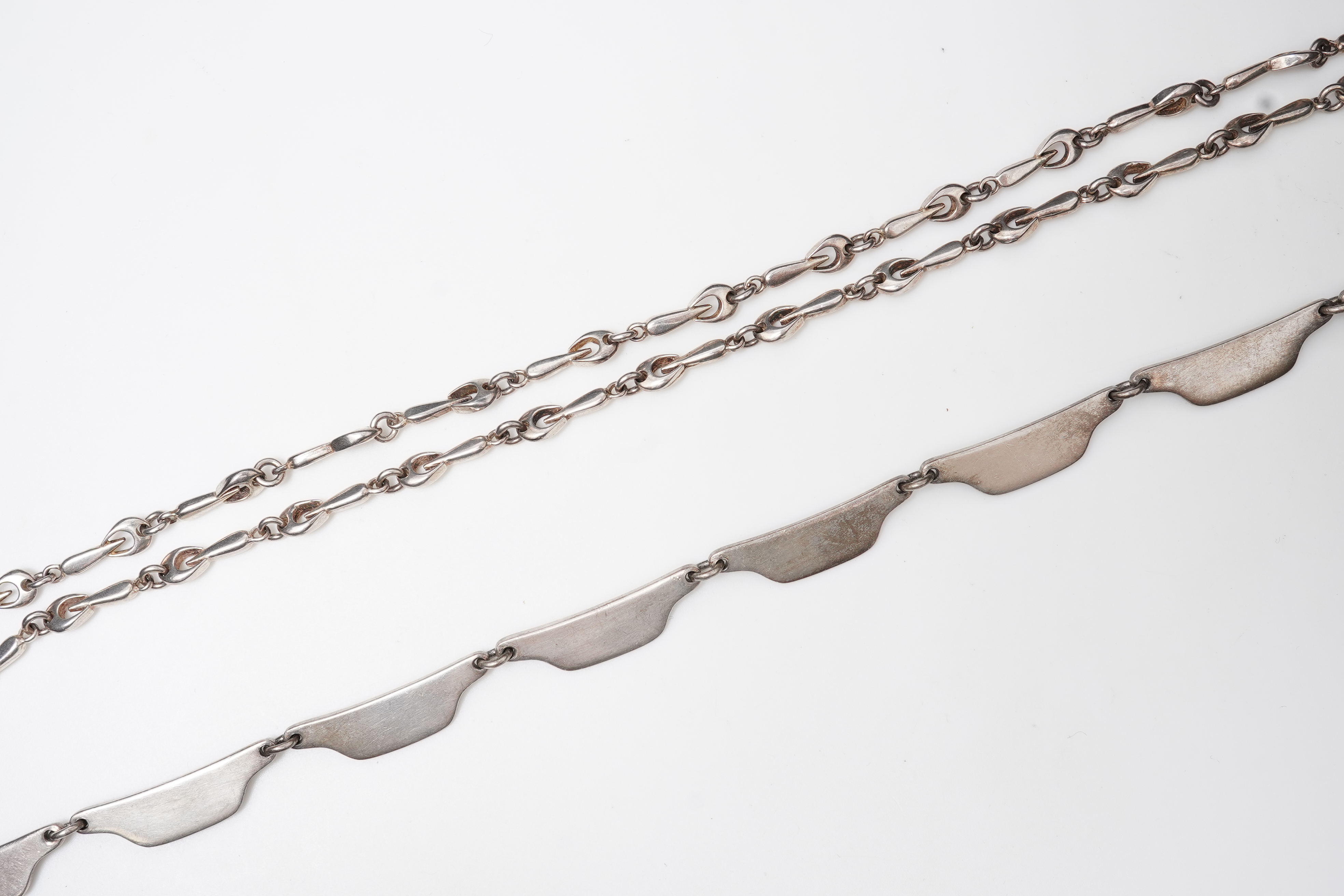 Bent Knudsen, a modernist silver necklace, Denmark, circa 1968, and a silver chain necklace